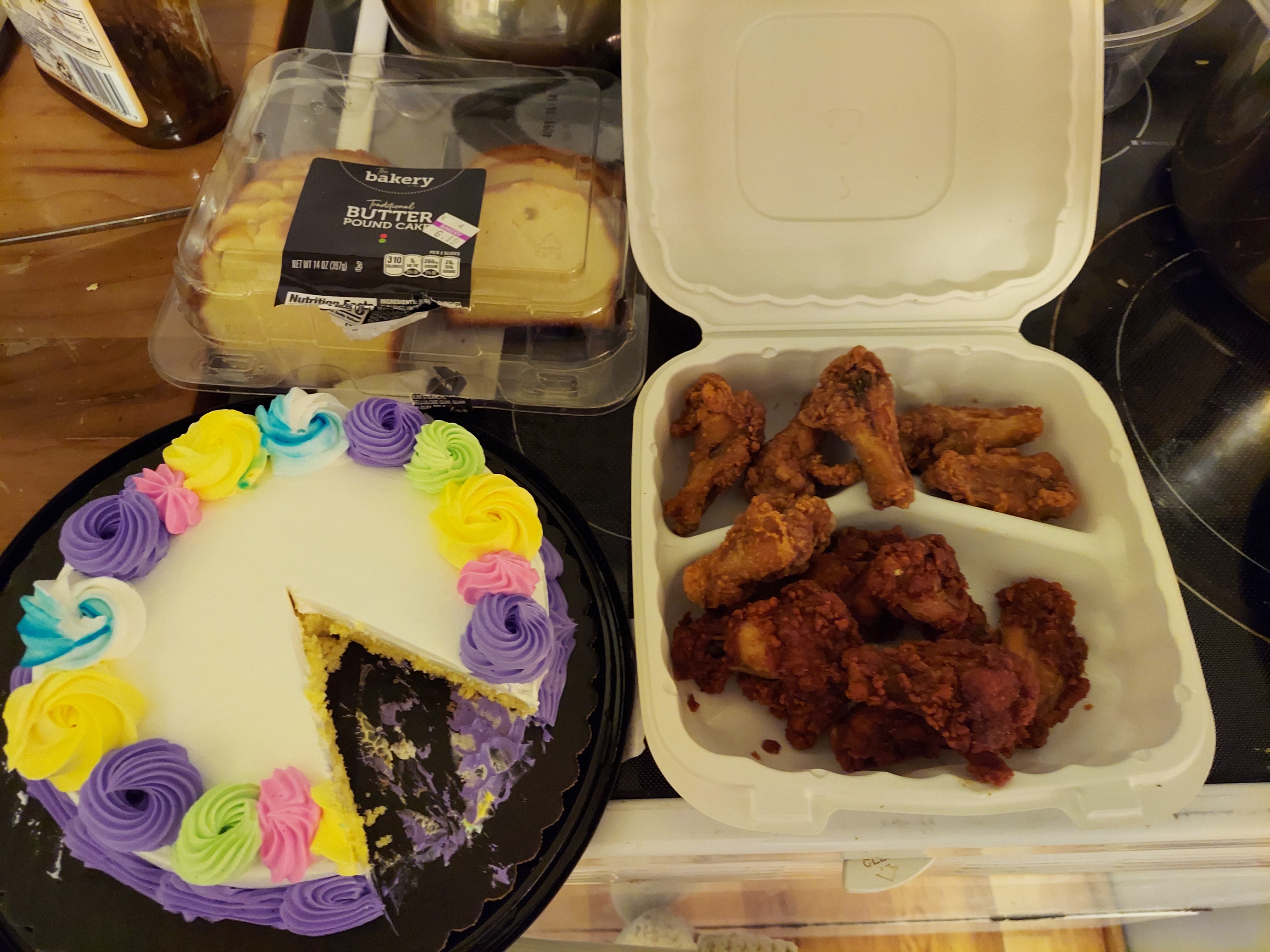 A picture of cake and chicken wings