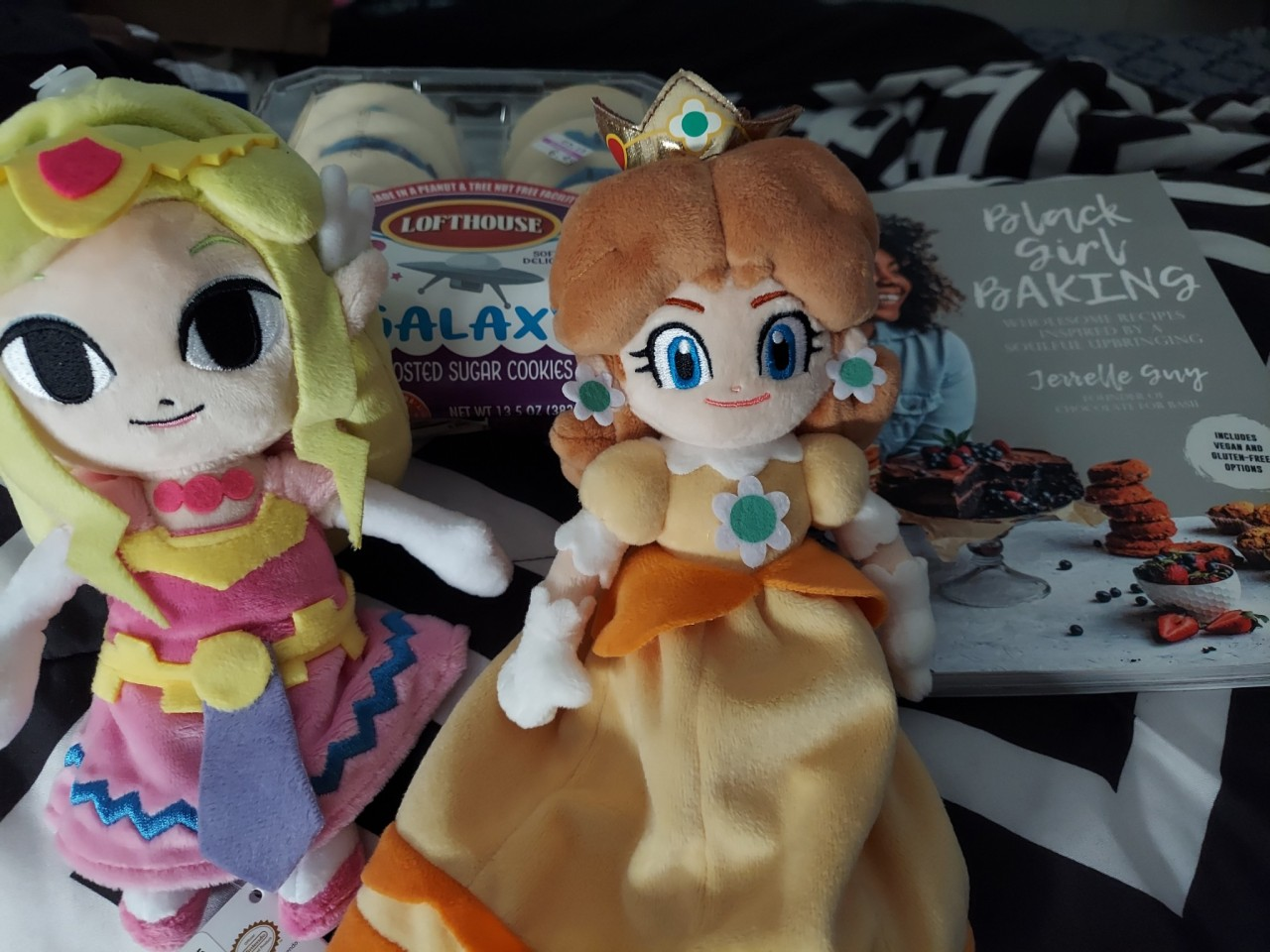 Presents I got for my birthday: two dolls, a cookbook, and cookies